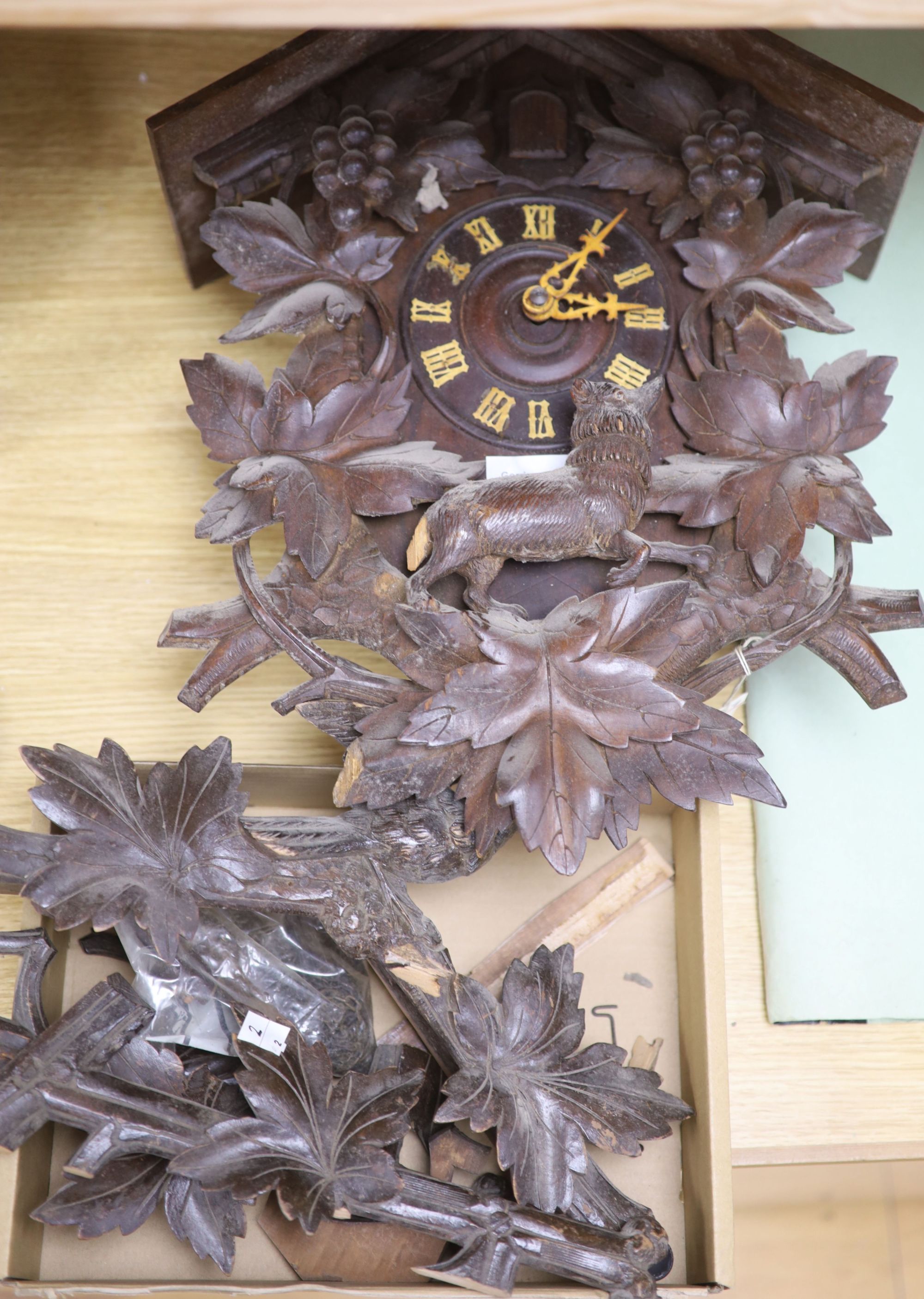 A Black Forest cuckoo wall clock, late 19th century, 47.5cm high, additional associated parts